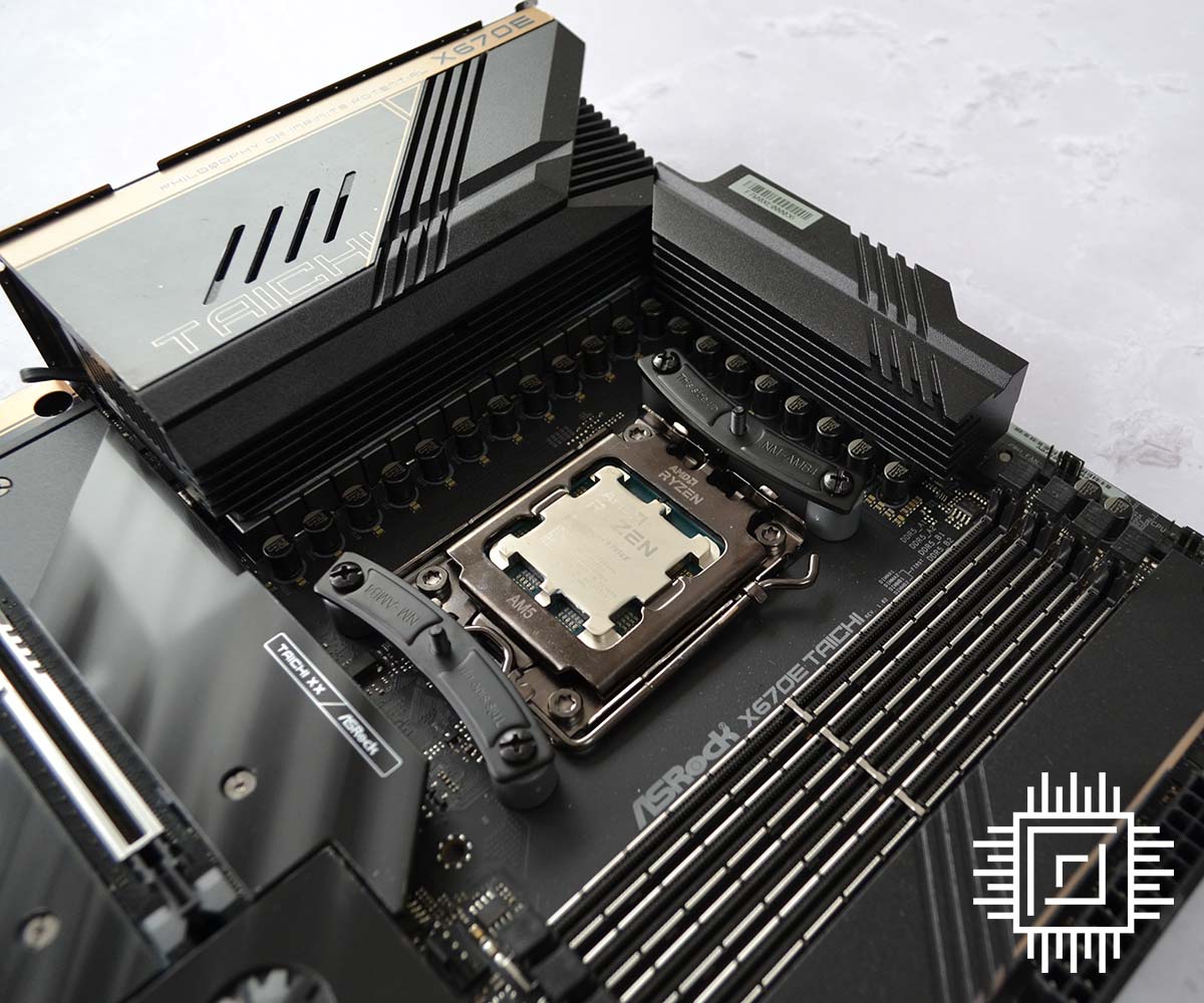Close-up of ASRock X670E Taichi with an AMD CPU mounted.