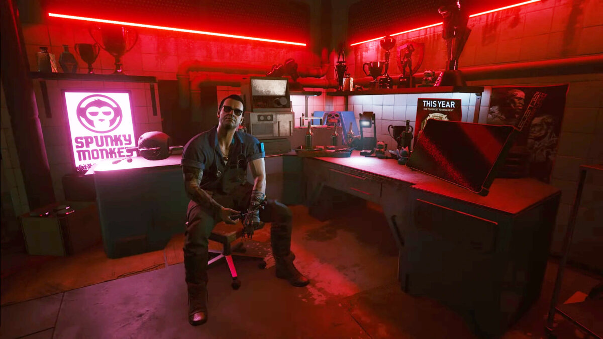 Cyberpunk 2077's doctor Viktor Vektor sitting in his shop with a neon red background.