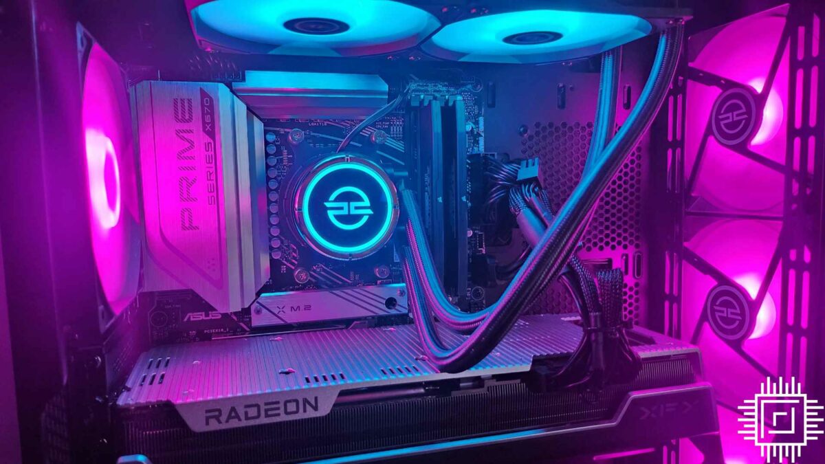 The PCSpecialist Odin TX gaming PC with the brand logo lit up in blue on the CPU cooler.