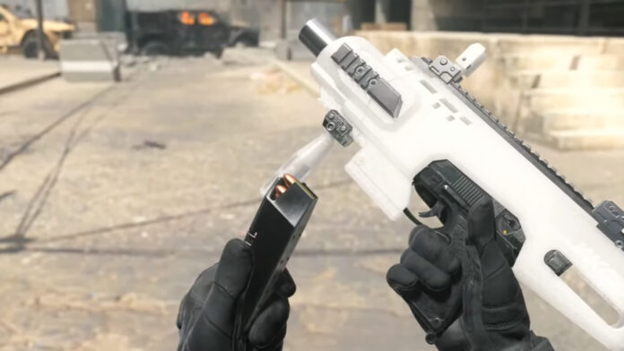 A Call of Duty Modern Warfare 3 Uzi held up as the player reloads ammo.