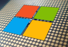 The Microsoft logo sits on top of a CPU chip