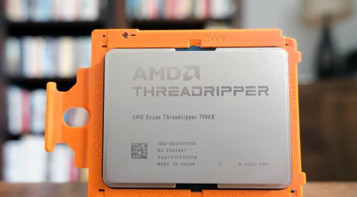 AMD Ryzen Threadripper 7980X CPU set against a blurred background.