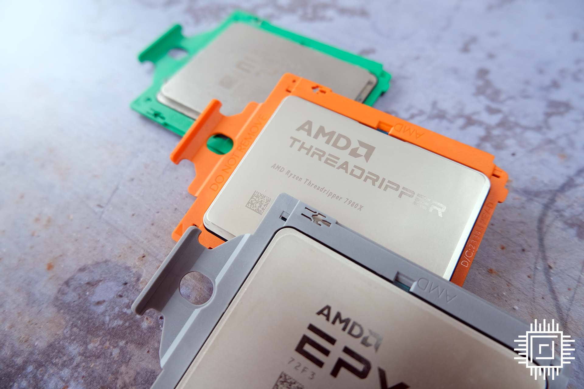 AMD Ryzen Threadripper 7980X sandwiched between Epyc processors.
