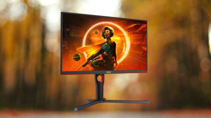 AOC Q27G3XMN-BK 27in gaming monitor on a forest background.