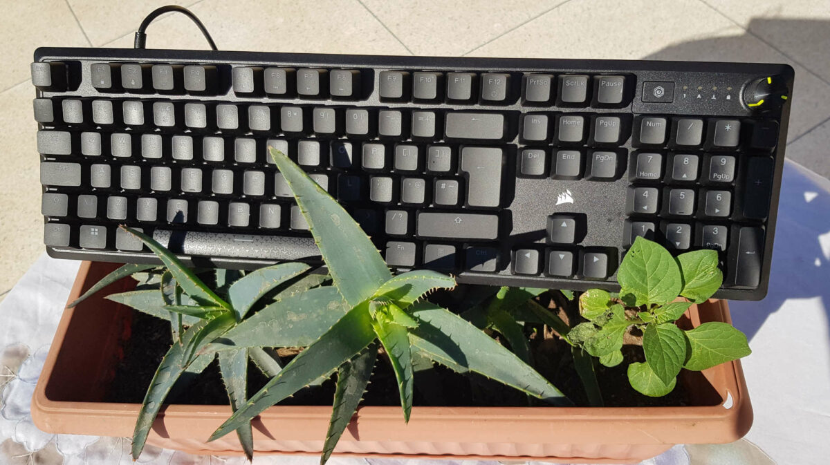 Corsair K70 Core RGB mechanical keyboard on top of a plant pot.
