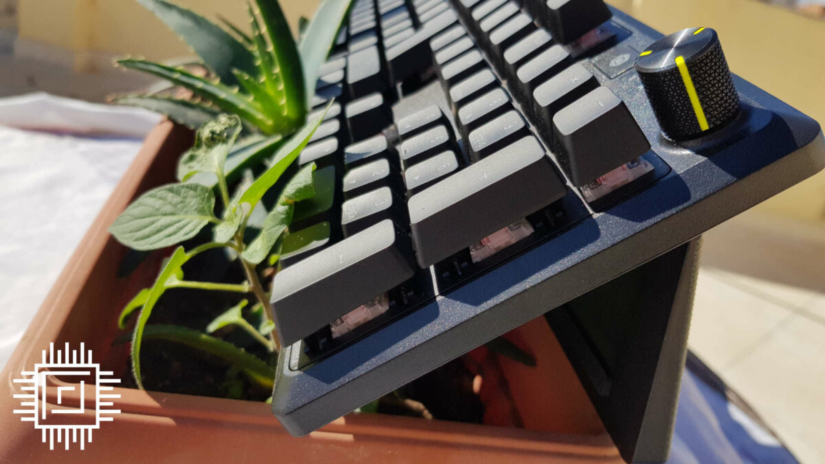 Corsair K70 Core RGB mechanical keyboard side view on a plant pot.