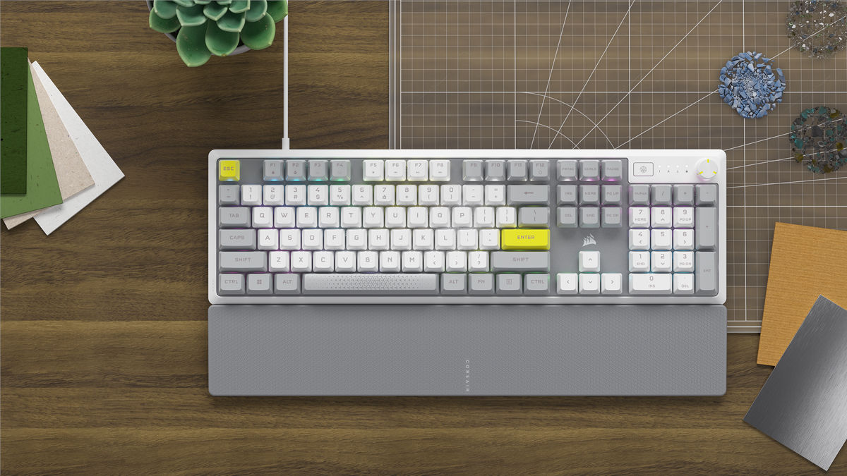 Corsair K70 Core SE gaming keyboard with custom grey and yellow keycaps.