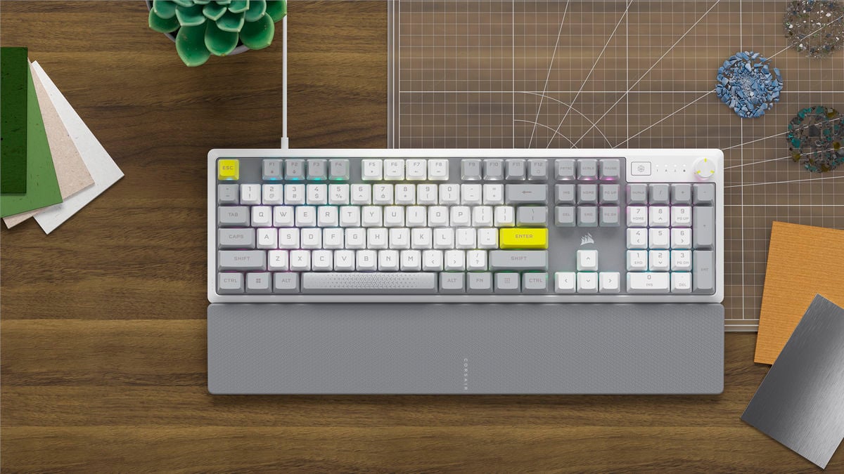 Corsair K70 Core SE gaming keyboard with custom grey and yellow keycaps.