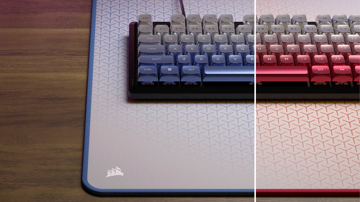 Corsair K70 Core SE gaming keyboard, with half the image using metallic blue and the other half using metallic red keycaps.