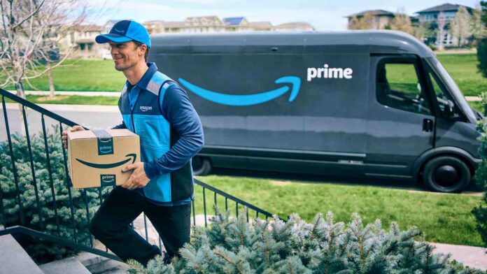 Amazon driver delivers a parcel next to a Prime van.