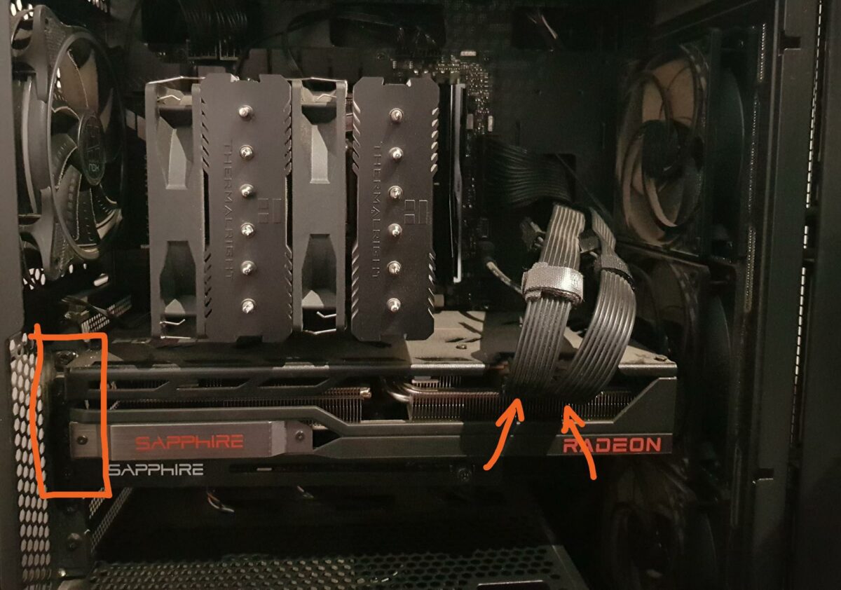 Graphics card screws (left) and power cable (right).