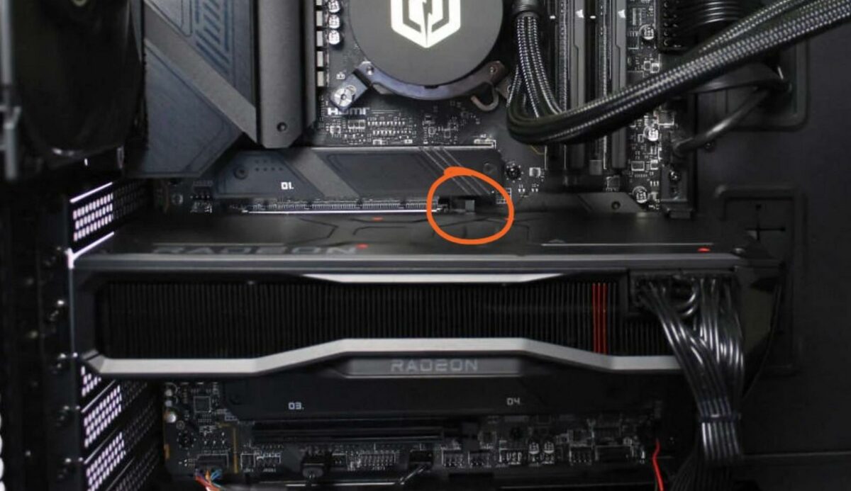 PCIe latch beneath GPU.