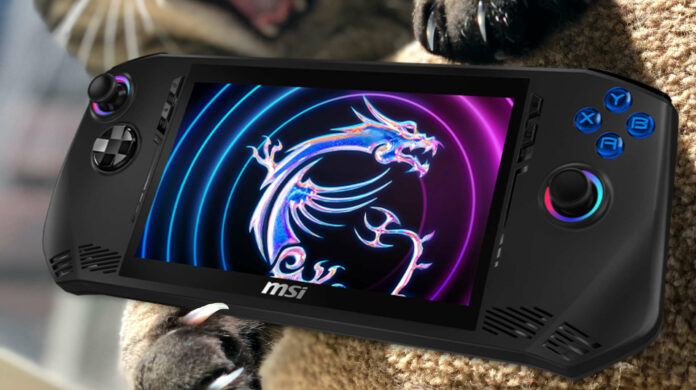 A cat playing with an MSI Claw gaming handheld.