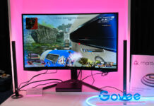 See Govee AI Sync Box Kit 2 in action, shining pink light behind the gaming monitor.