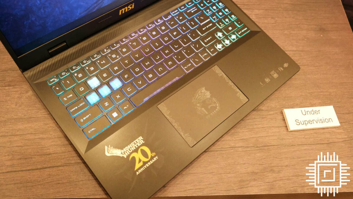 MSI gaming laptop trackpad has Monster Hunter's Rathios logo curled in the centre.
