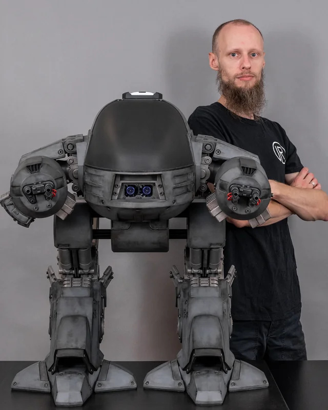 Robocop ED-209 gaming PC mod size comparison, standing about half the size of a person.