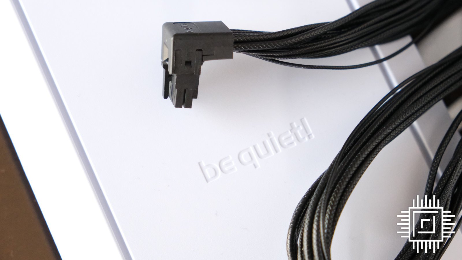 A be quiet! 12VHPWR cable with an angled head for easy connection to a compatible graphics card.