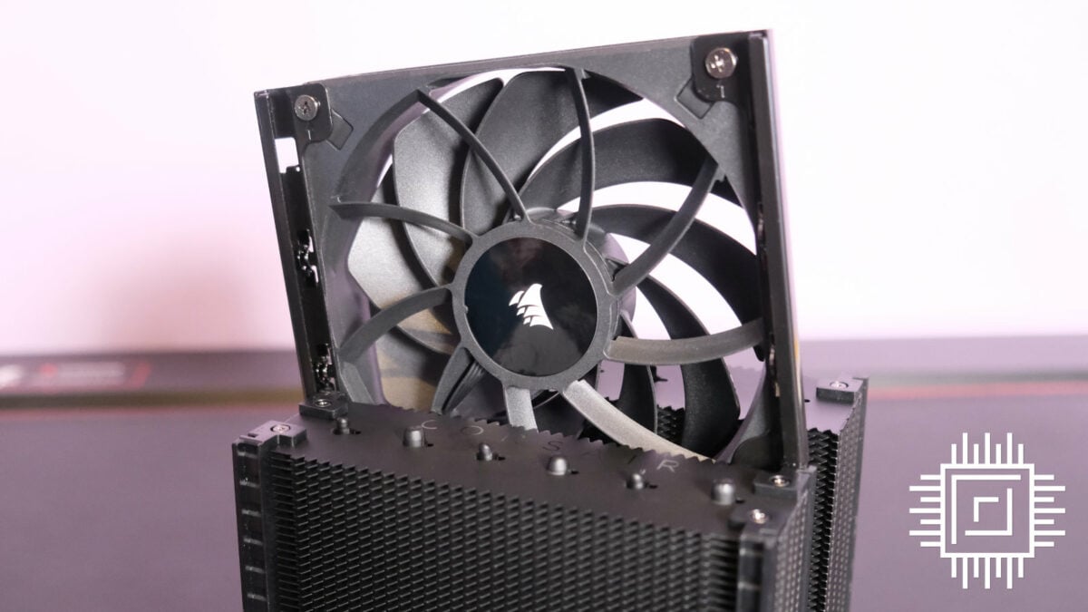 Corsair A115 CPU cooler with the central fan sliding out the rail mount.