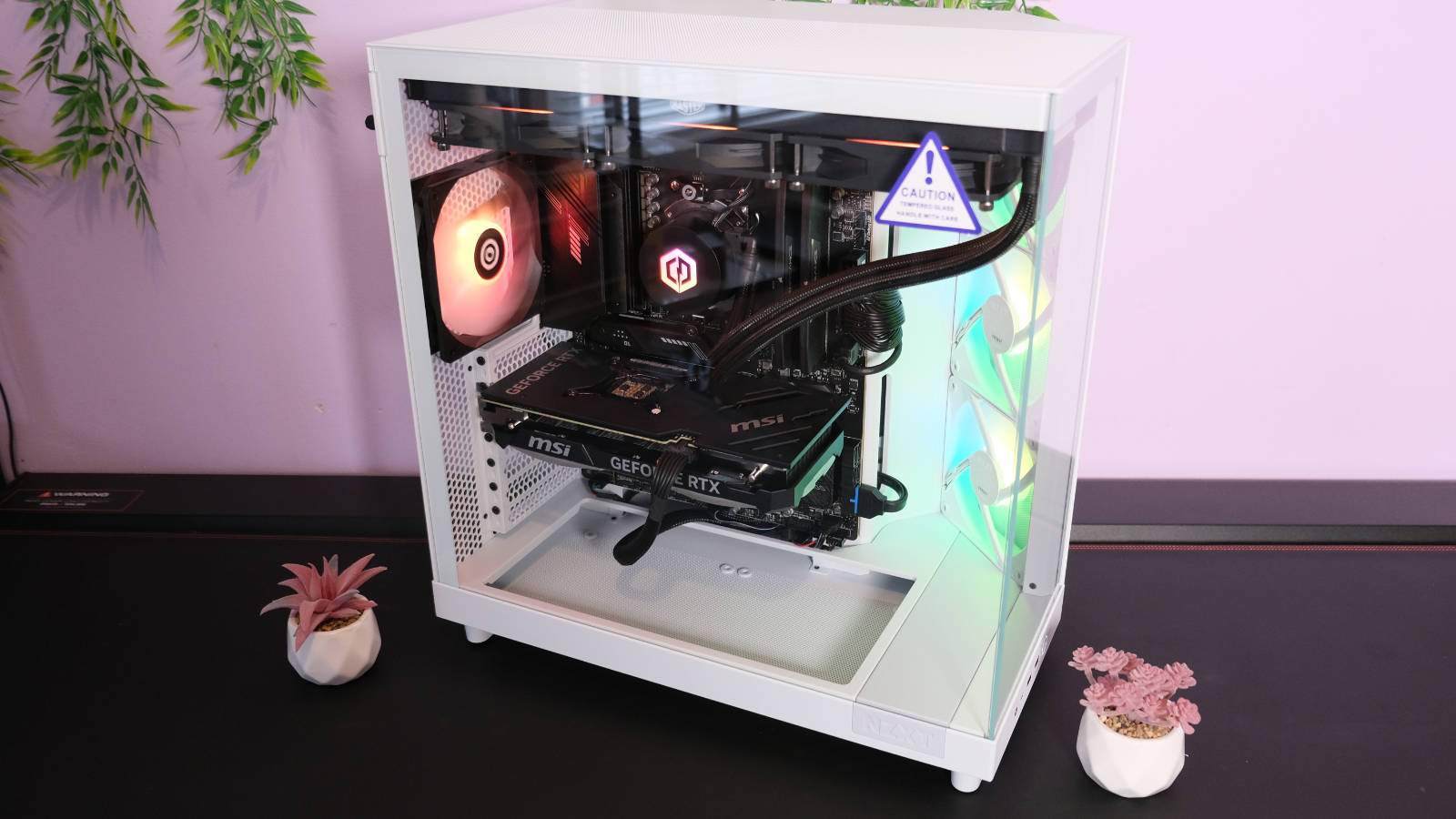 CyberpowerPC UK Ultra R77 with its RGB lights shining against the white case.