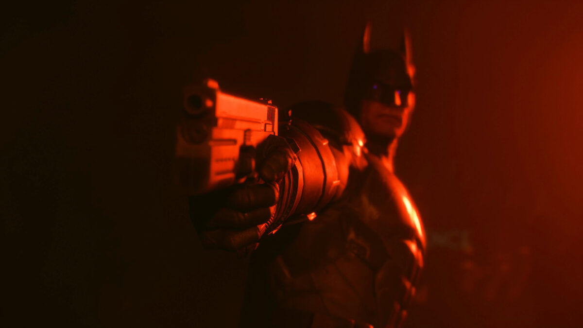 Batman holds a gun up to the Suicide Squad.