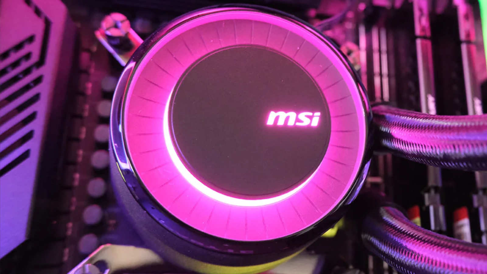 MSI MAG CoreLiquid E360 AIO cooler shining pink lighting.