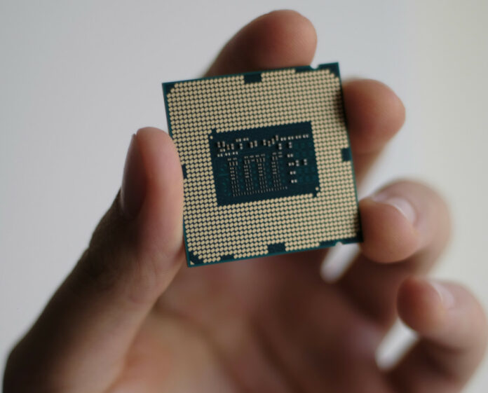 Intel i5 chip in hand by Niek Doup via Unsplash