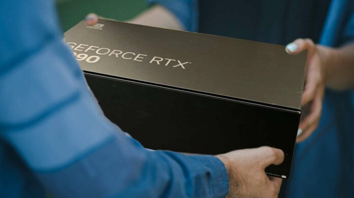 A person receiving a GeForce RTX graphics card parcel.
