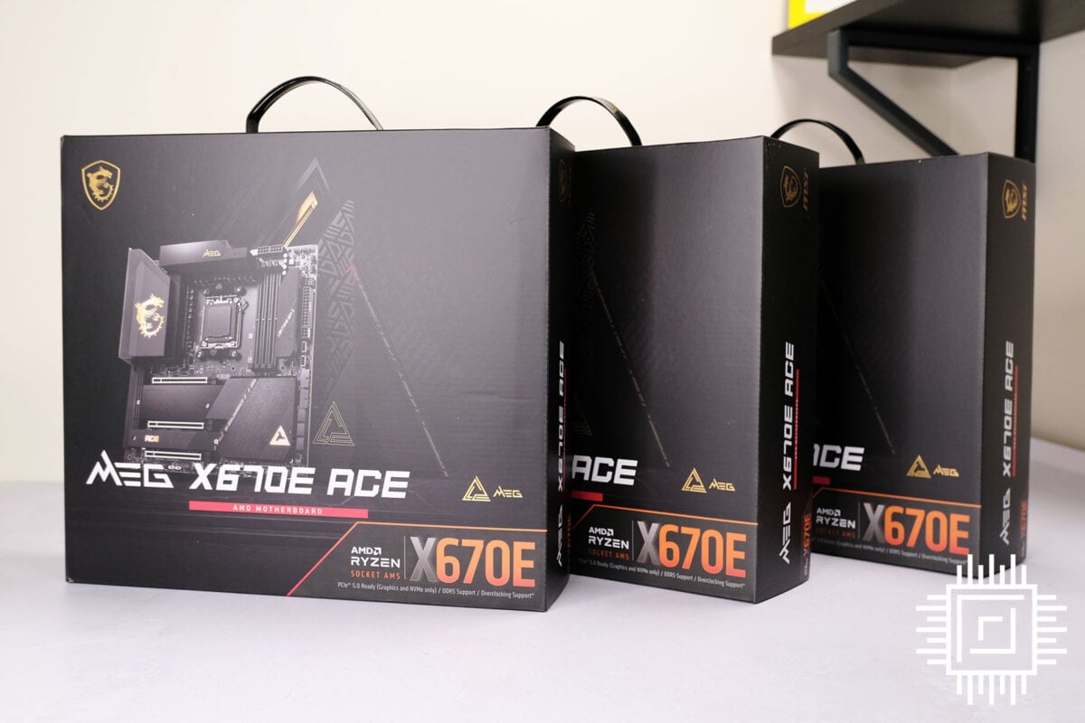 Trio of boxed MSI MEG X670E ACE motherboards standing like dominos.