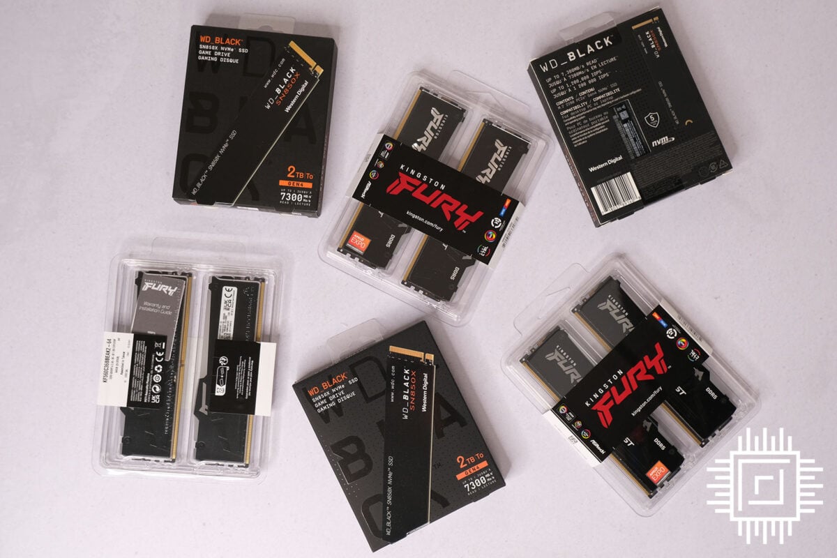 Three 2TB WD_Black SN850X SSDs laid next to three 64GB Kingston Fury Beast DDR5 memory kits.