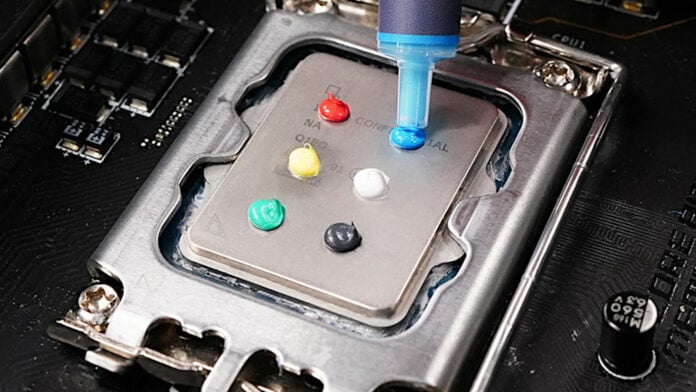 Six dots of Cooler Master CyroFuze 5 AI Thermal Paste, of varying colour, atop an Intel heat spreader