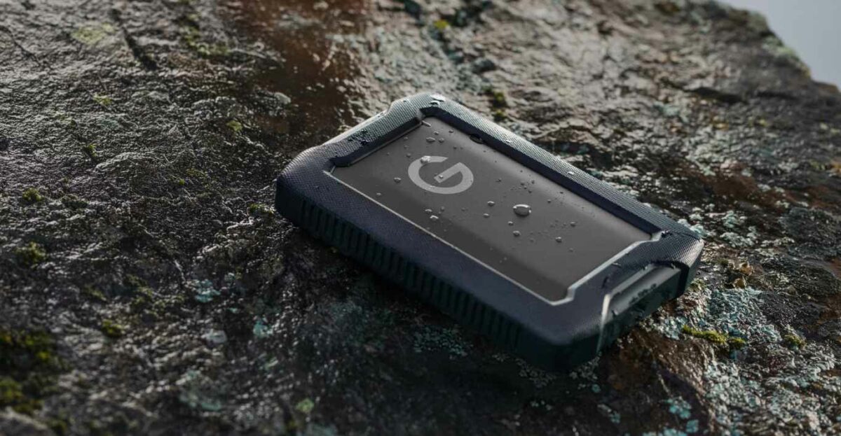 6TB SanDisk Professional G-DRIVE ArmorATD on a rock.