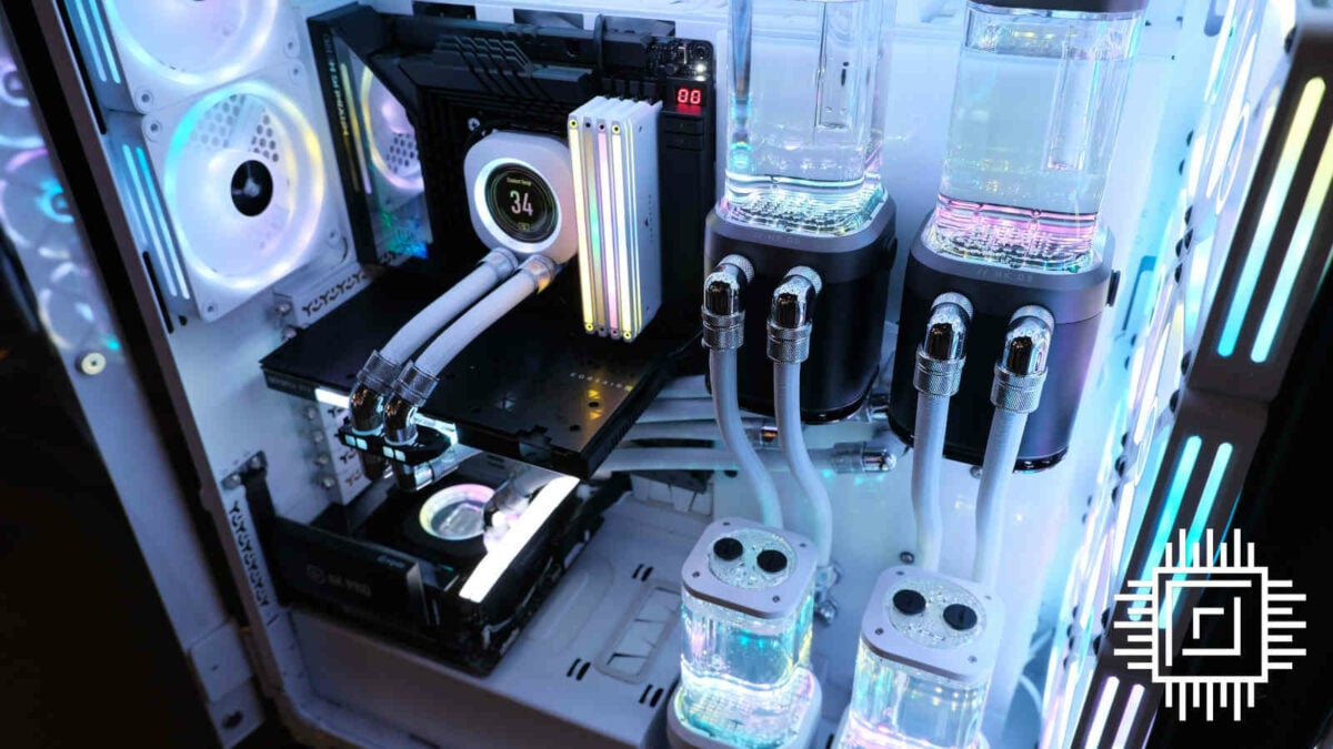 Interior of Corsair 9000D RGB Airflow, featuring two motherboards (left) with several radiators and pumps (right)