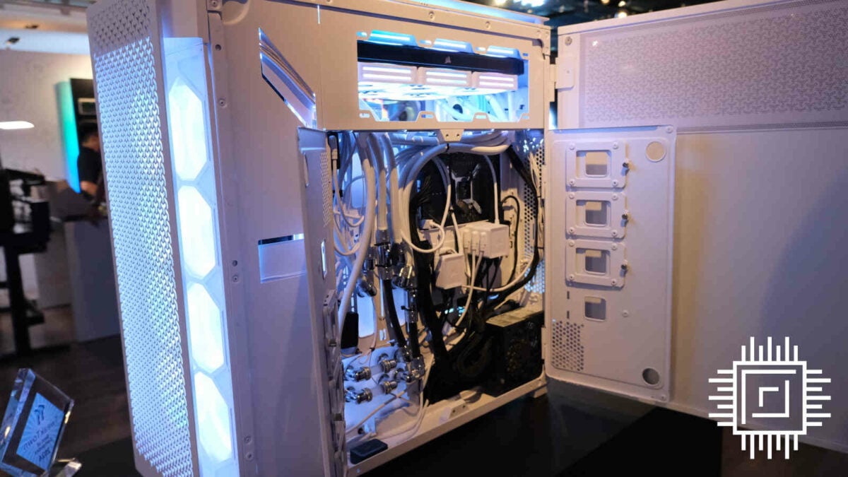 The back panel of Corsair 9000D RGB Airflow opened up, revealing its cable management systems