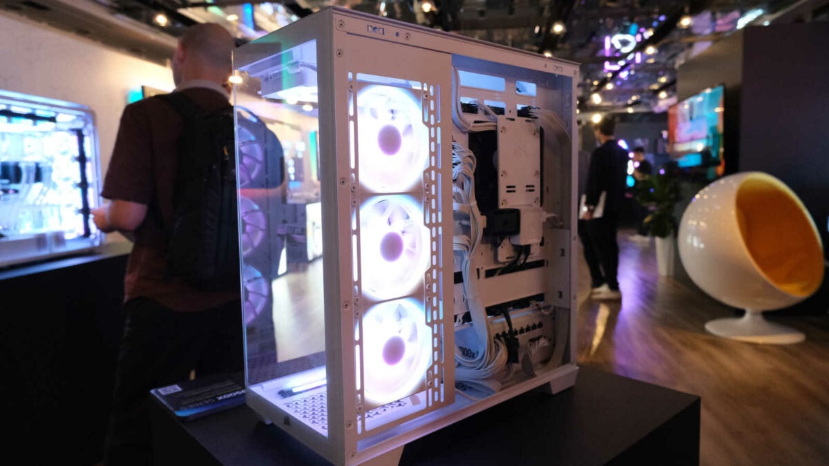The back of Corsair 3500X, with a 360mm AIO water cooler radiator and cable management features on display
