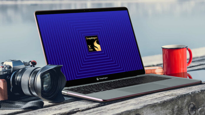 Snapdragon X Elite laptop, on a wooden bench, with a camera (left) and coffee cup (right) next to it