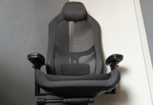 Fractal Design Refine review: sitting pretty Fractal Design Refine from a low angle, the chair resting against a grey wall and white door.