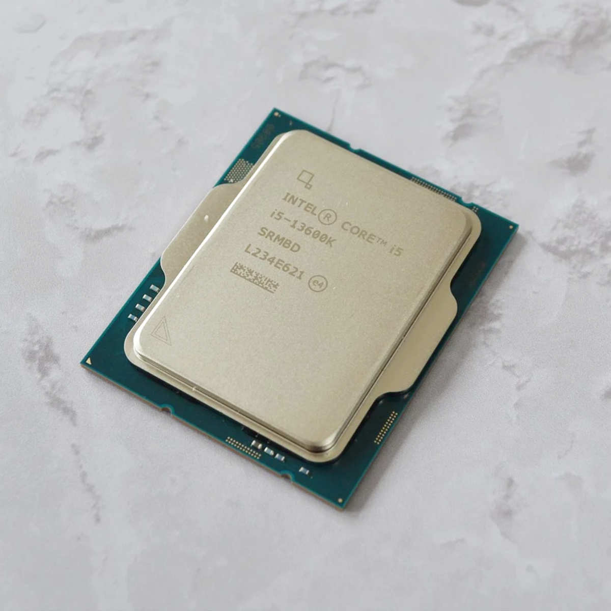 Intel Core i5-13600K lying flat on a table.