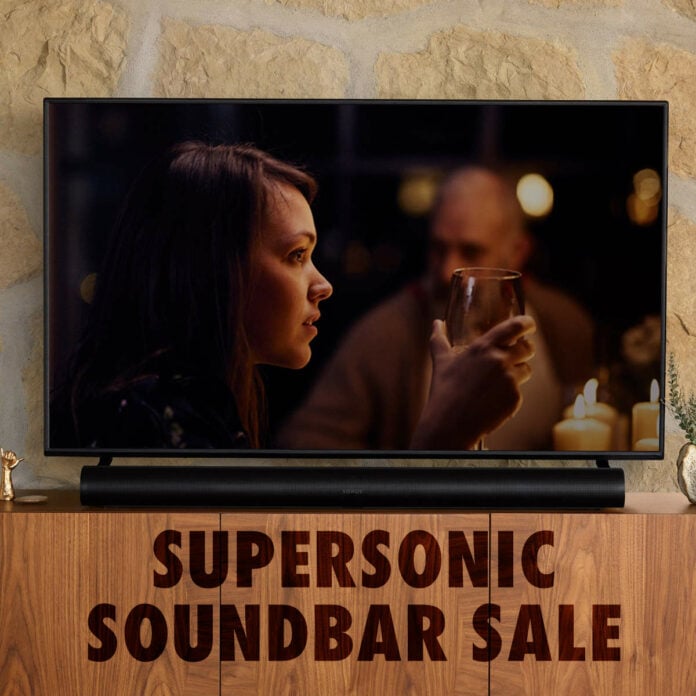 Sonos Arc in matte black under a TV but above text reading 