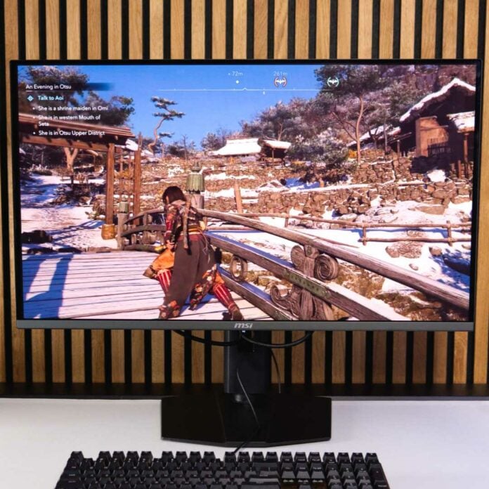 MSI MPG 322URX QD-OLED with Assassin's Creed Shadows on screen.