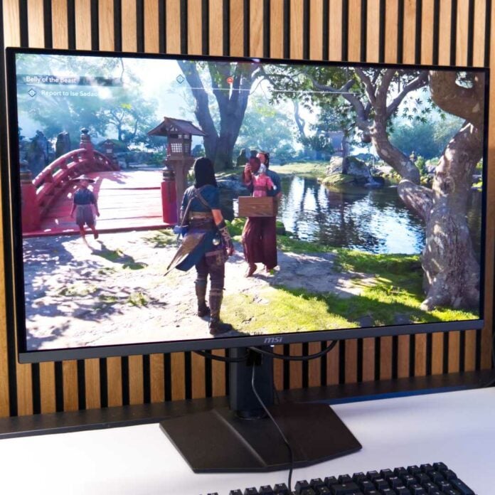 MSI MPG 322URX QD-OLED with Assassin's Creed Shadows on screen.