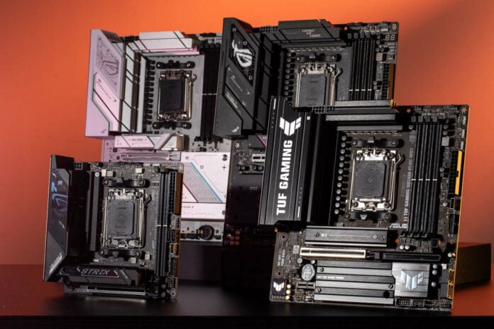 A group shot of various Asus motherboards, including models from the manufacturer's ROG and TUF Gaming series.