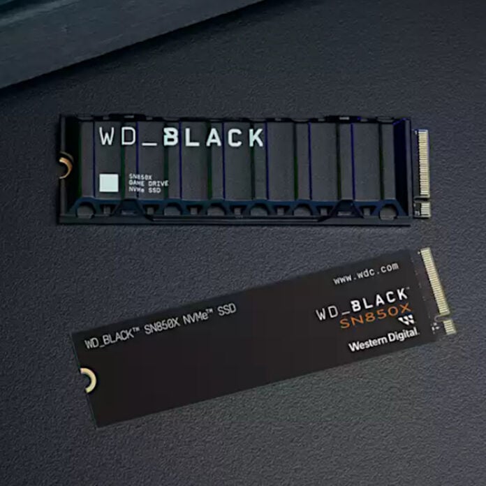 WD_Black SSDs sitting atop a black leather-like surface.