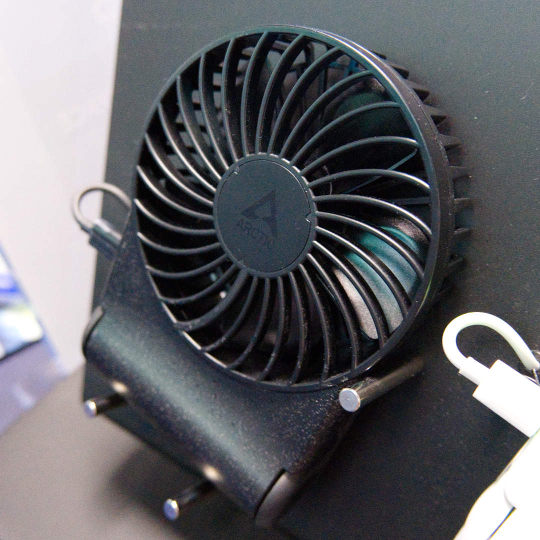 Close-up of Summer2Go portable fan in black.
