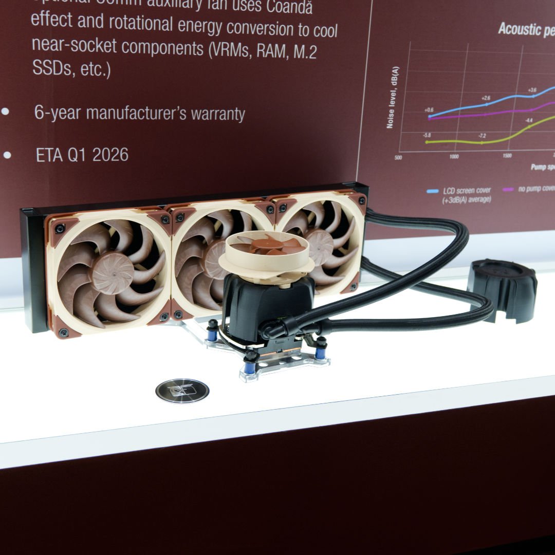 Noctua AIO cooler sat on a desk with beige fans.