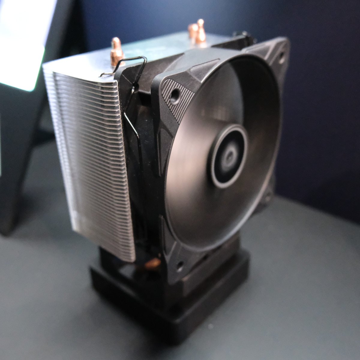 Side view of Arctic Freezer 8 CPU cooler, its fan spinning and attached to its heatsink.