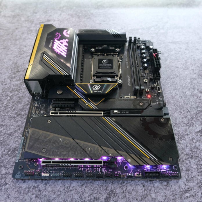 ASRock Taichi OCF motherboard, resting against a grey background.