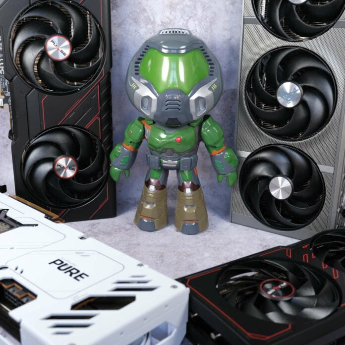 Doomguy collectible figure stands amidst an array of Sapphire Radeon graphics cards.