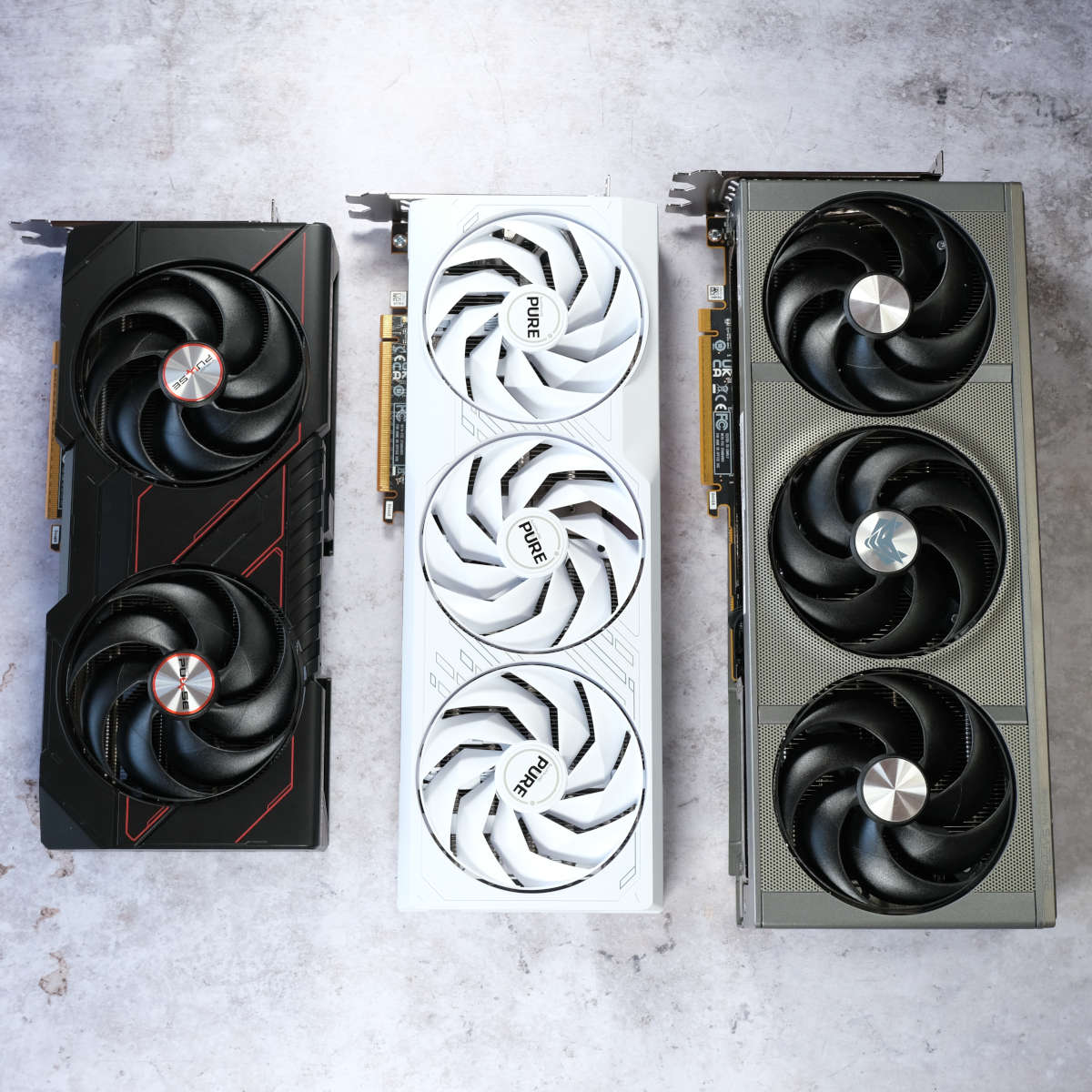 Sapphire Pulse (left), Pure (centre), and Nitro+ (right) Radeon graphics cards.