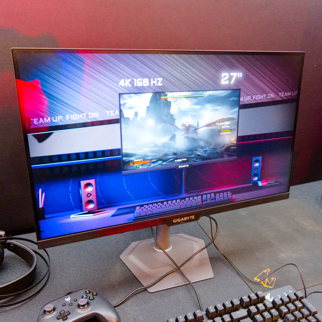 Gigabyte M27UP gaming monitor in black facing right.