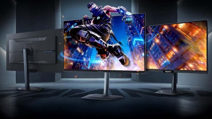 Gigabyte M27UP Gaming monitor with a character breaking through the screen.